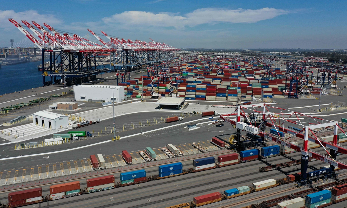 An aerial image shows cargo shipping containers and cranes as cargo containers sit stacked on freight trains at the Port of Long Beach in Long Beach, California on April 10, 2025. Photo: VCG