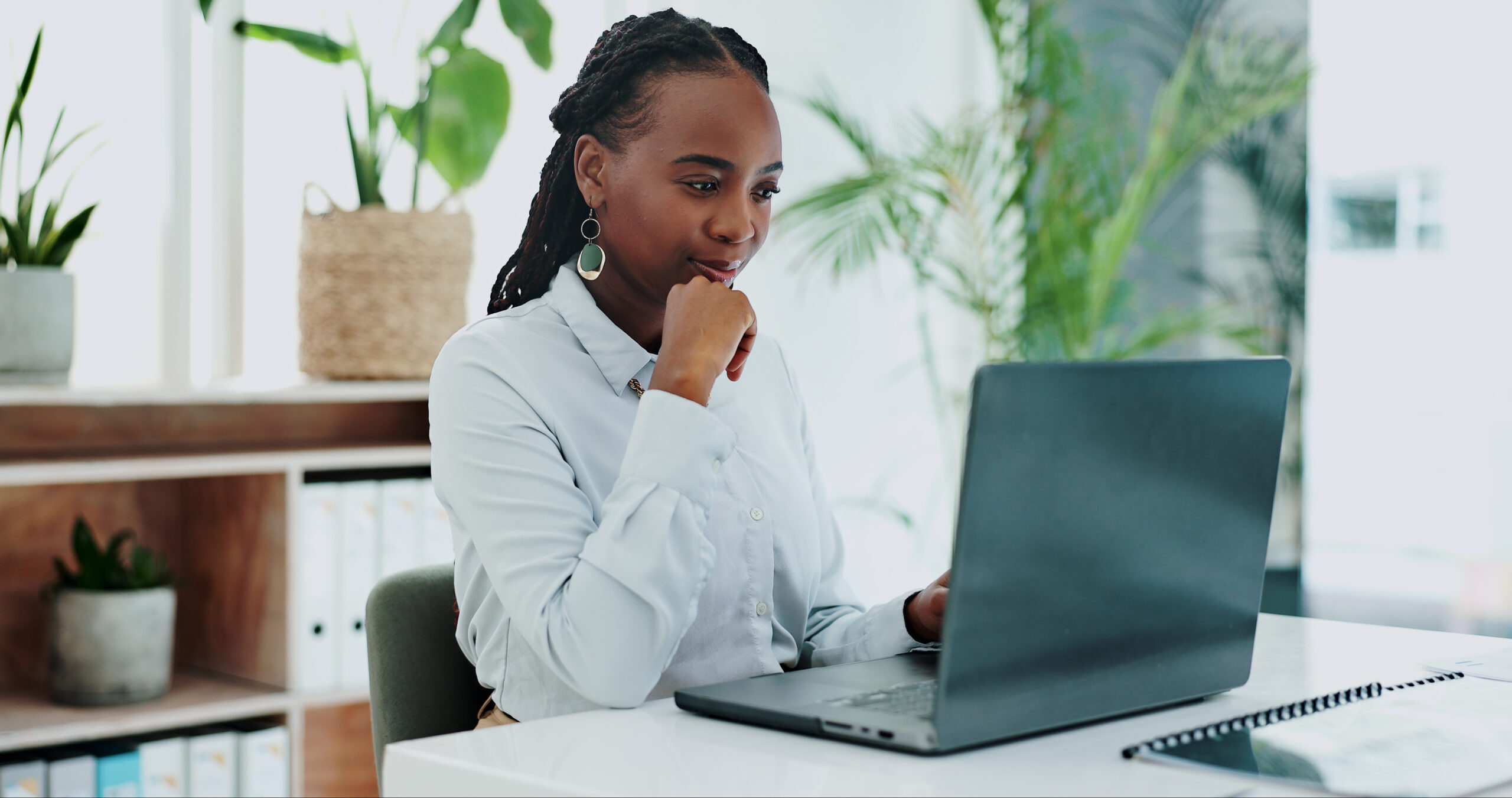 A businesswoman working on her laptop.