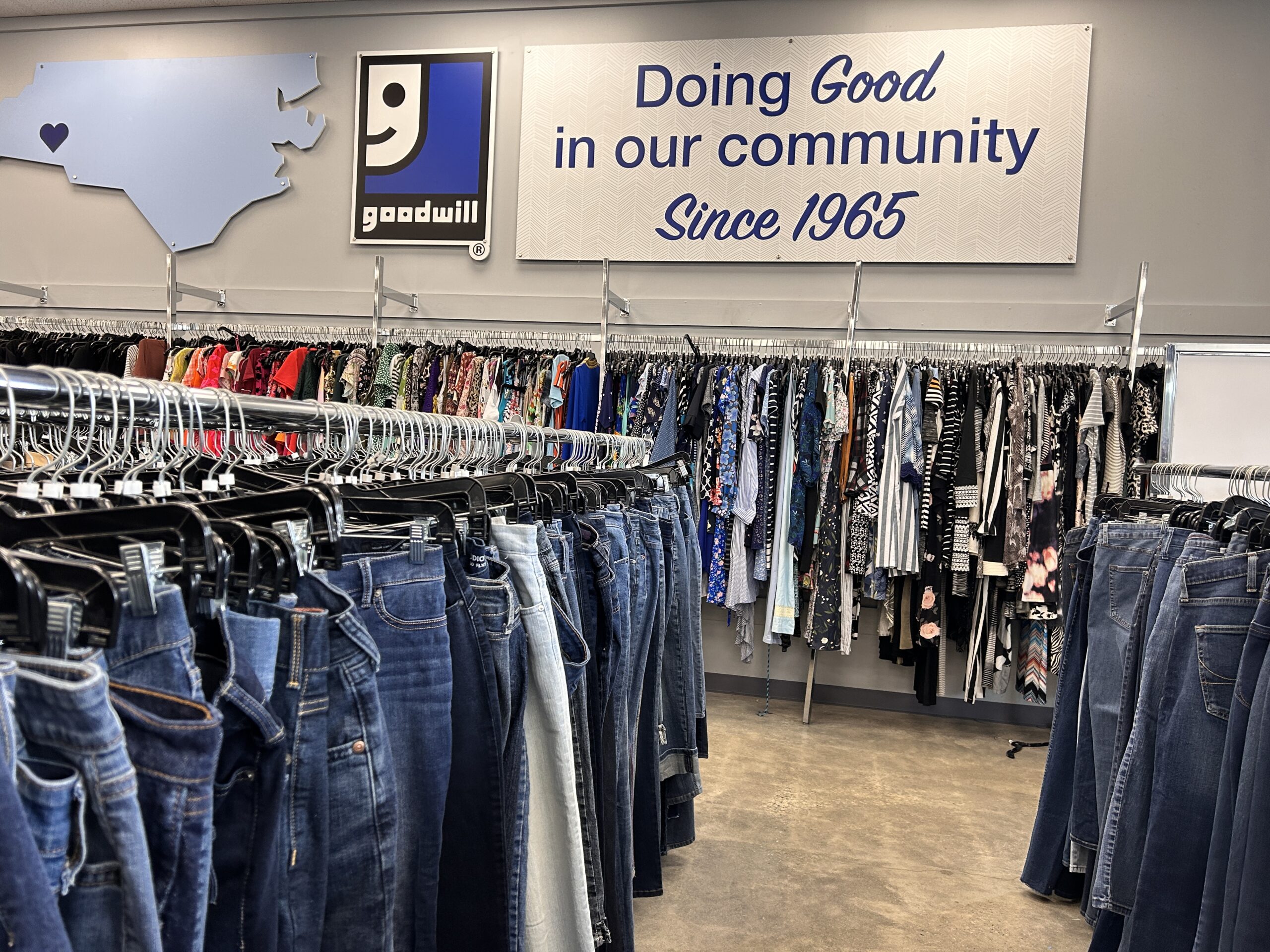 Clothing racks in a Goodwill store.