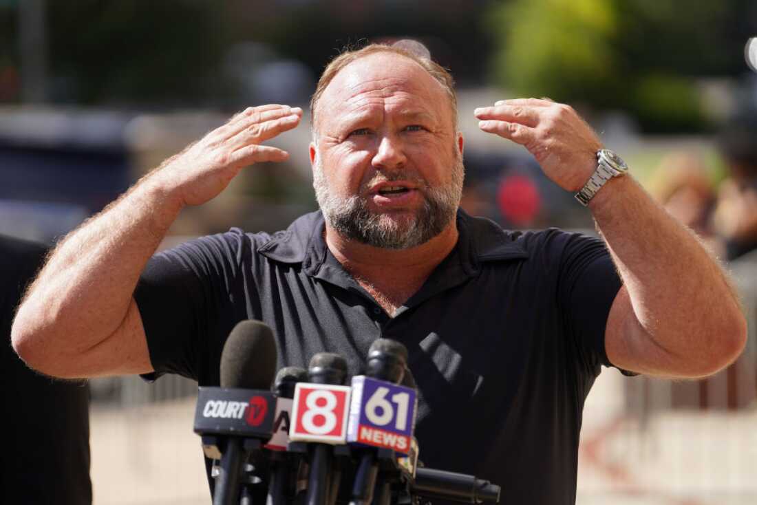 Conspiracy theorist Alex Jones accused of hiding money from Sandy Hook families