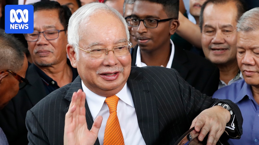 Former Malaysia PM discharged but not acquitted of money laundering charges