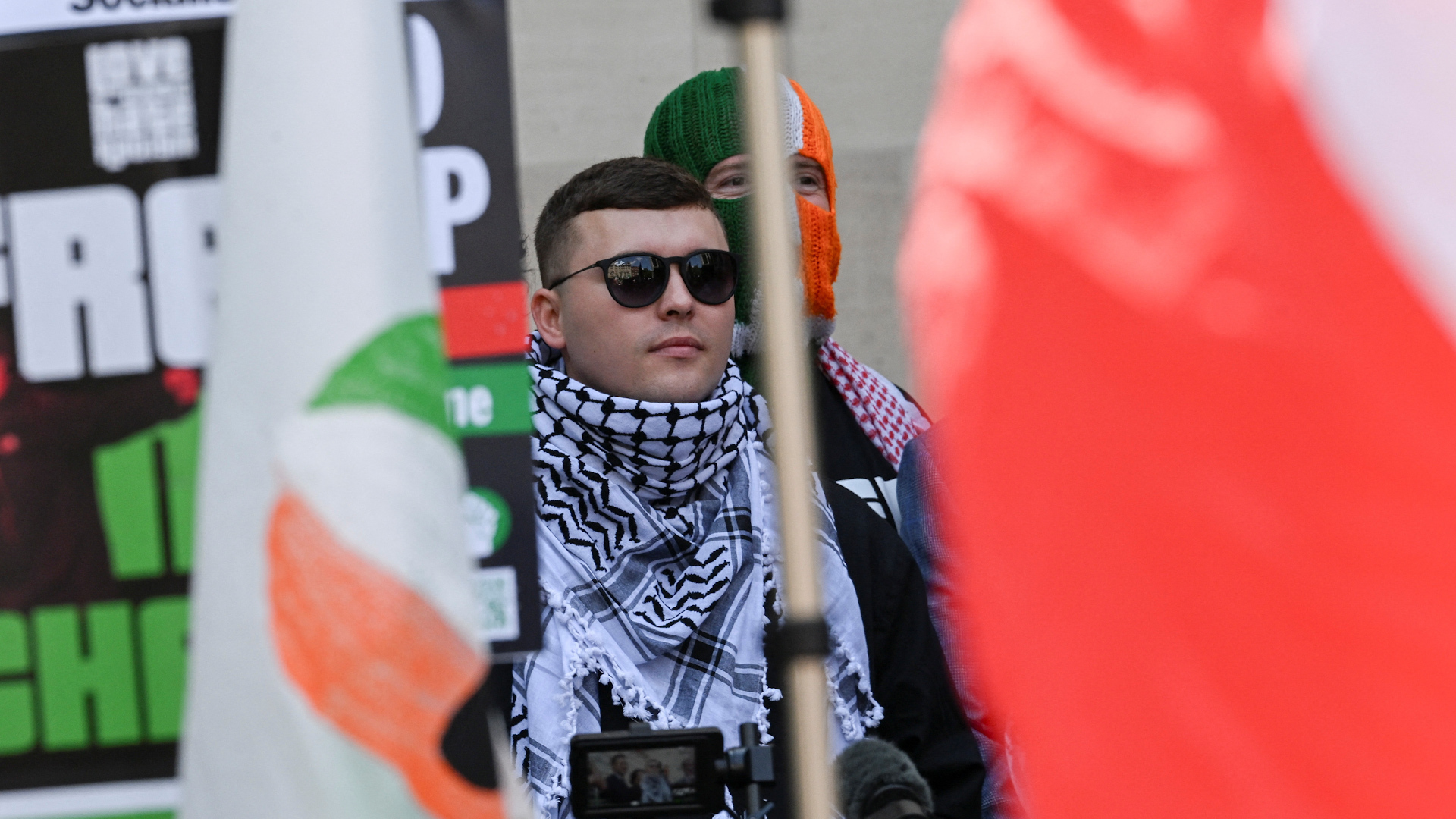 Kneecap rapper in UK court on “terrorism” charge over flag
