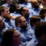 Corrections officer graduates sit during their ceremony Wednesday, Feb. 21, 2024, at Madison Area Technical College in Madison, Wis. Angela Major/WPR